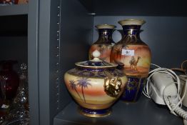 Three pieces of Noritake having blue and gilt decoration with nomadic scenes