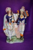 A Staffordshire flatback of two musicians approx 33cm tall
