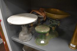 Two sets of kitchen balance scales including Victor and similar