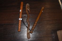 Two vintage police or similar style truncheons and an Indonesian style carved ceremonial club
