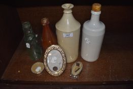 A selection of earthen ware and glass bottles