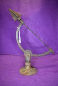 A cast iron garden ornament possibly the top of a sun dial or similar