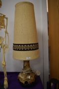 A mid century table lamp possibly West German pottery having under and over light with original
