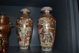 A pair of floor standing Japanese vase decorated with samurai