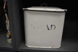 A vintage enamel kitchen bread bin