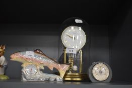A glass domed anniversary clock by Kundo
