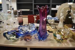 Four items of heavy art glass.