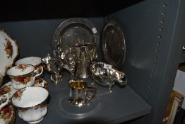 A selection of plated wares and two pewter dinner plates
