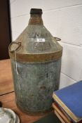 A large vintage petrol can.