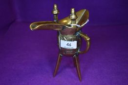 An antique Chinese ceremonial Jue wine vessel or taotie having archaic design and good signs of age