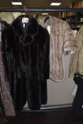 A faux fur coat and vintage stole.
