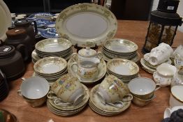 A Shofu dinner service having floral pattern on ivory and white ground. Around 52 pieces.