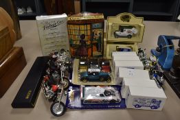 A collection of car and bike miniatures.
