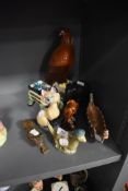 A collection of decorative ceramics including three Beswick Whisky Flasks, Golden Eagle, smaller