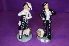 Two Royal Doulton figures, Pearly Boy HN2767 and Pearly Girl HN2769, both bearing signatures to