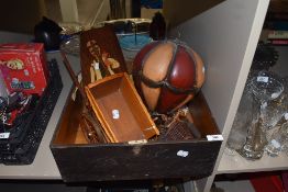 A vintage wooden box containing a wooden cart,hot air balloon decoration and similar.