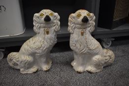 A pair of antique Staffordshire flat back dogs approx 33cm tall