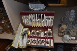 A collection of garden ornaments including owls and rabbits.