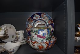 An Imari pattern punch or fruit bowl and similar charger plate also a Cantonese styled ginger jar