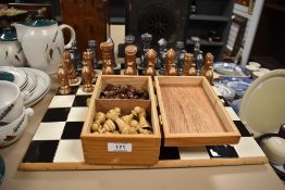 A ceramic chess board and chess pieces also included is a box of wooden chess pieces.