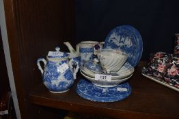 A delft ware tea cup and saucer and similar porcelain tea wares