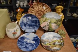 A selection of ceramic display plates by Royal Doulton and similar also two Sadler jars