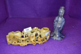 A carved soap stone bud vase having crow and deer depiction and similar oriental figurine.