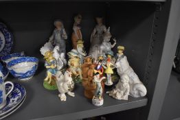 A selection of figures and figurines including bisque glazed and Liverpool crested ware chicken