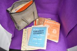 A bag of vintage sheet music and books.