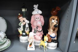 Three novelty musical cocktail or spirit decanters and similar