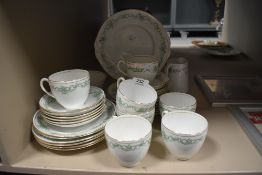 A selection of Wellington china having green transfer pattern with gilt detailing.