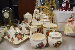 A collection of kitchen ware including tea pot, cheese dishes, planters and more.