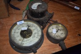 Three amp and pressure gauges.