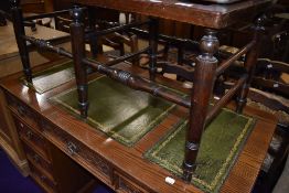 An Edwardian luggage stand or double seated stool on turned oak frame