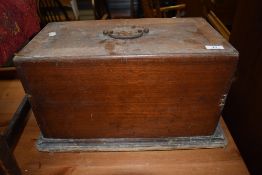 A vintage sewing machine in wooden case