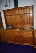 A modern yellow pine dresser base and shelf back of good proportions