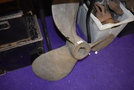 A large vintage boat prop