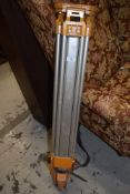 A surveyors tripod (aluminium frame)