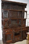 An 18th Century and later Tridarn style sideboard/dresser with typical ostentatious pokerwork and