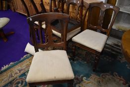 A set of six mahogany framed Victorian dining chairs by J Reilly having vase back design