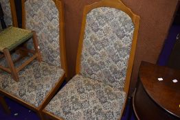 A set of four light oak dining chairs in a light oak by Parker Knoll