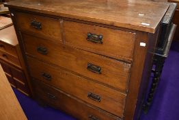 An Edwardian chest of two over three oak drawers
