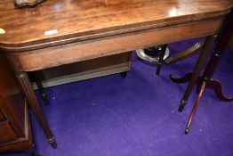 A Victorian light mahogany fold out games or tea table