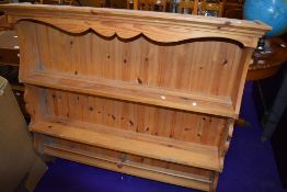 A modern yellow pine kitchen plate rack or shelf unit