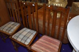 Three matching rail back dining chairs in oak