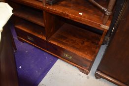 A modern hard wood side board or cabinet having open front and under drawers