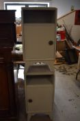 A pair of painted bedside cabinets