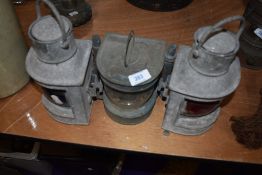 Three vintage nautical lamps, one labelled Port another Starboard and the last masthead.