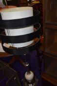 An Art Deco style chrome standard lamp and a modern complimentary light shade