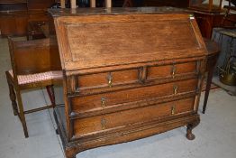 A late 19th or early 20th Century oak bureau , on heavy Queen Anne style legs, width approx. 106cm